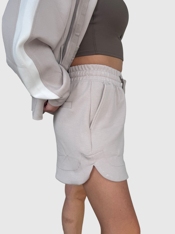 Side view of erson wearing a light mocha colored jogger short