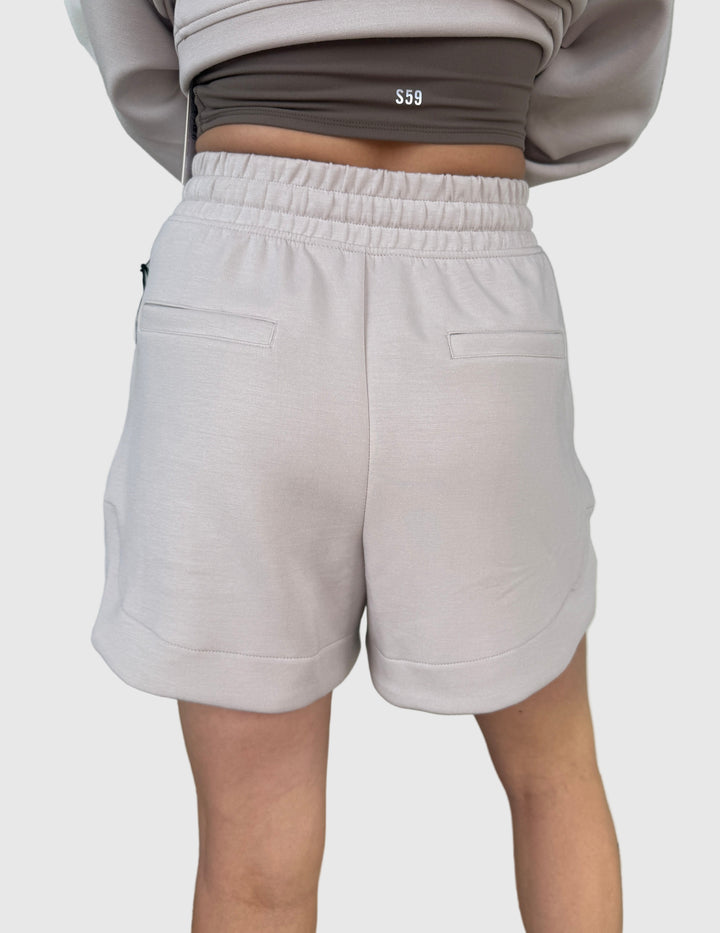 Rear view of person wearing a light mocha colored jogger short