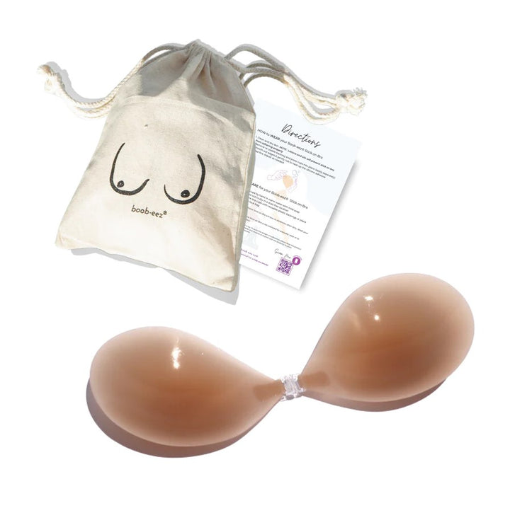 Product shot of Boob-eez Medium Tint Silicone Stick On Bra with canvas bag.