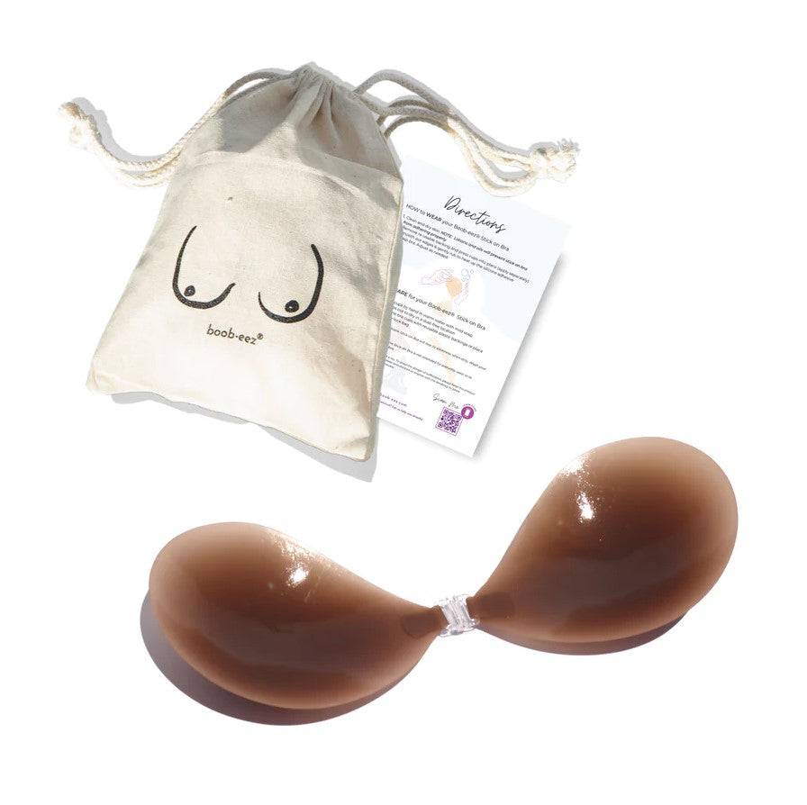 Product shot of Boob-eez Dark Tint Silicone Stick On Bra with canvas bag.