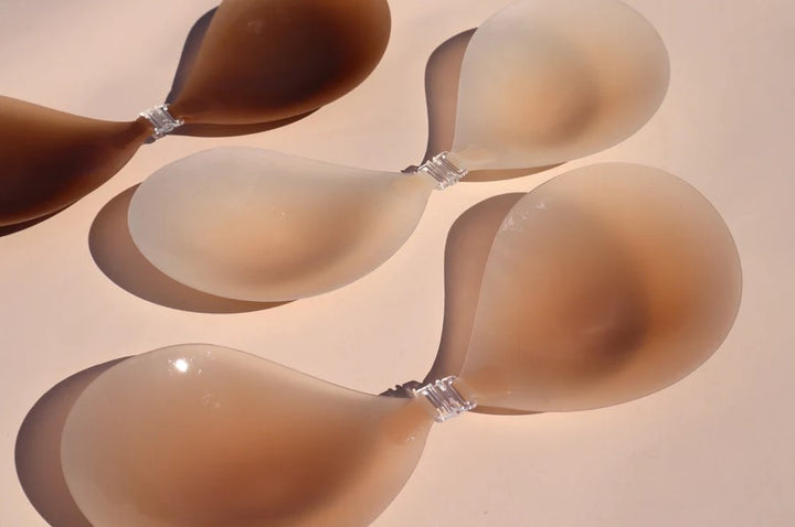 Product shot of Boob-eez Light Tint, Medium Tint, and Dark Tint Silicone Stick On Bras.
