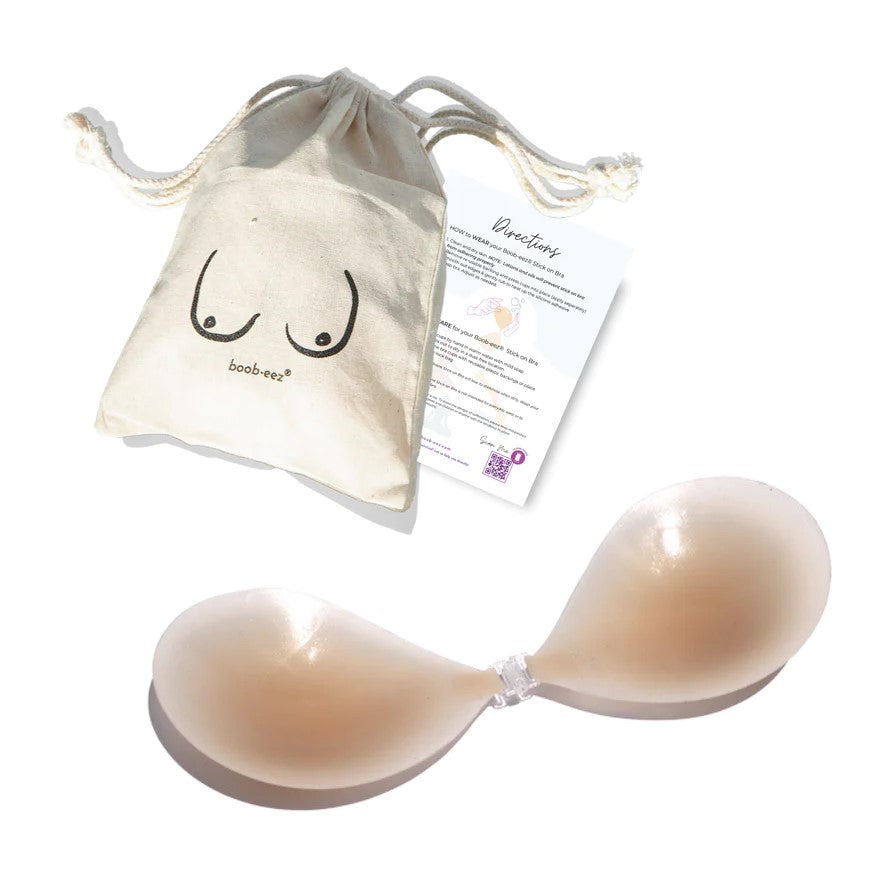 Product shot of Boob-eez Light Tint Silicone Stick On Bra with canvas bag.