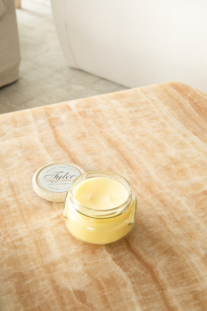 Product shot of Tyler Candle Company candle 11oz size in scent beach blonde.