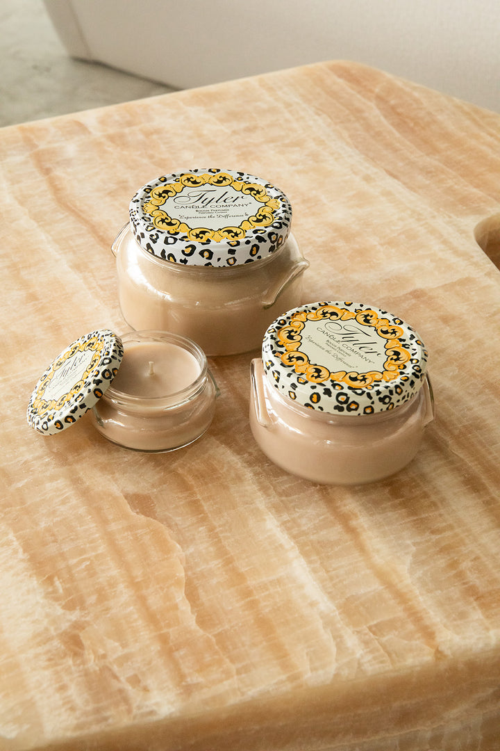 Product shot of Tyler Candle Company candles in 22oz, 11oz, and 3.4oz in scent celebrity.