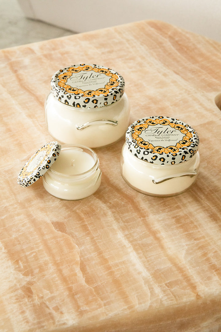Product shot of Tyler Candle Company candles in 22oz, 11oz, and 3.4oz in scent dolce vita.
