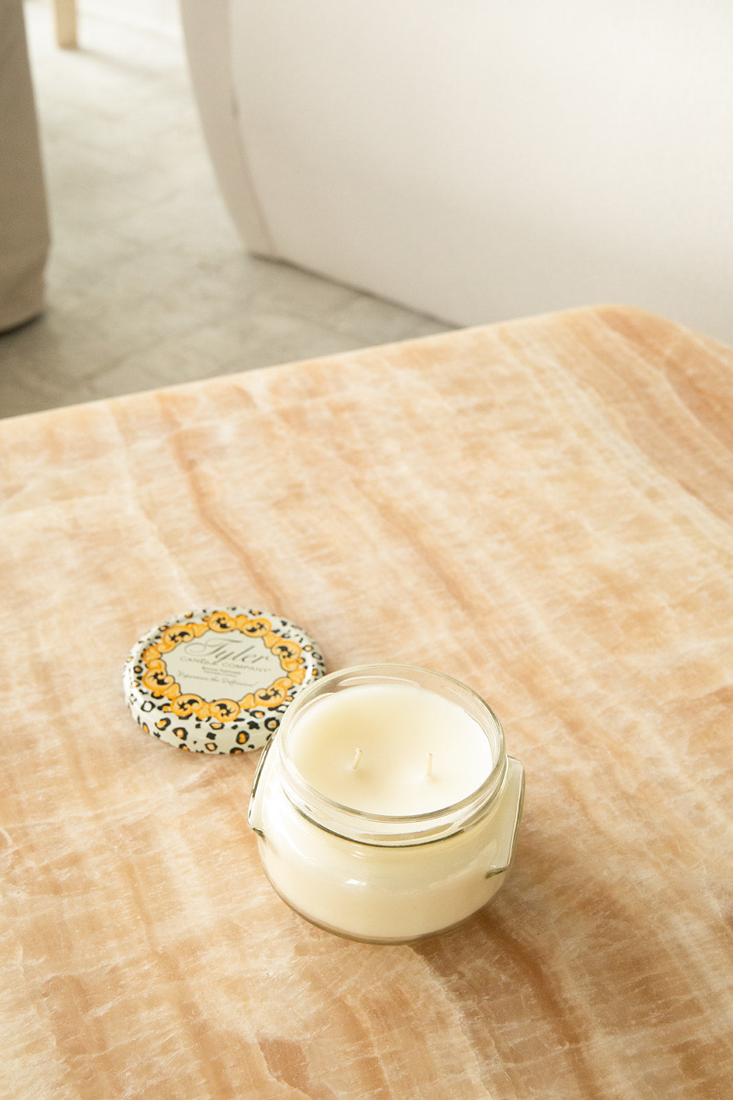 Product shot of Tyler Candle Company 11oz candle in scent french market.