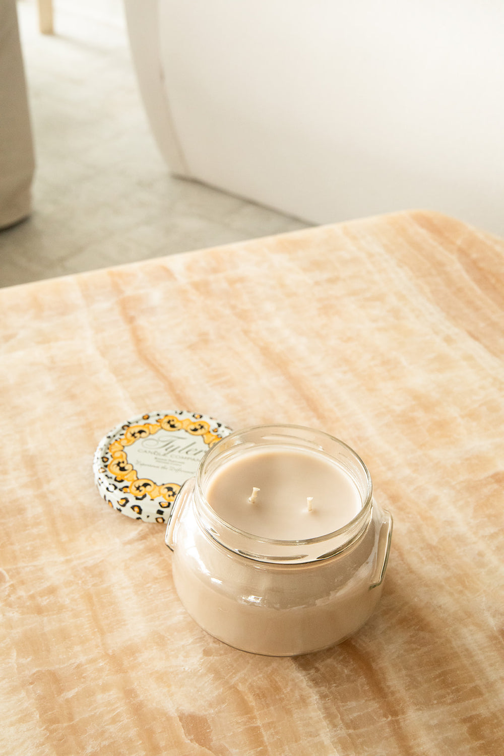Product shot of Tyler Candle Company 22oz candle in scent high maintenance.