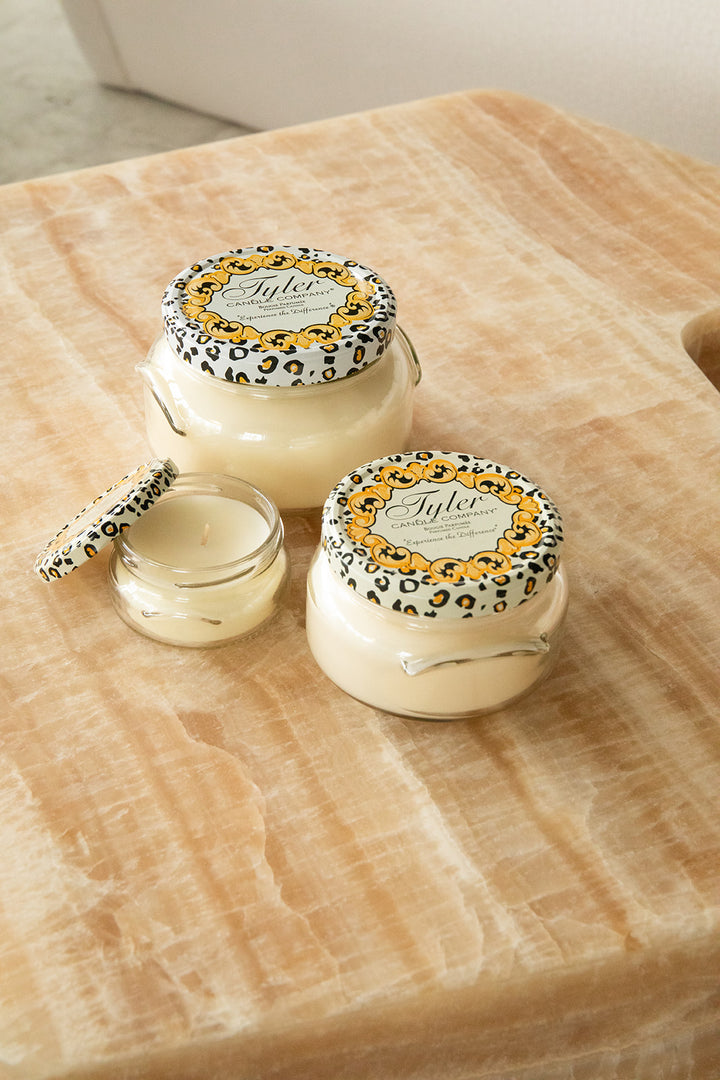 Product shot of Tyler Candle Company candles in 22oz, 11oz, and 3.4oz in scent regal.