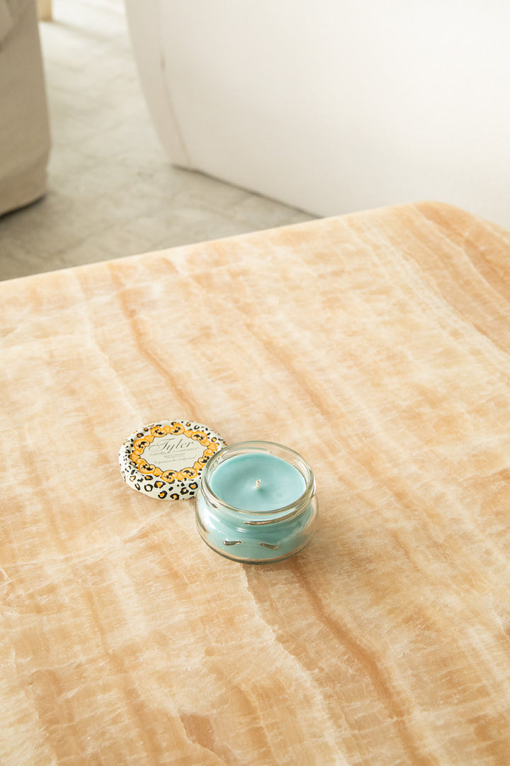 Product shot of Tyler Candle Company 3.4oz candle in scent resort.