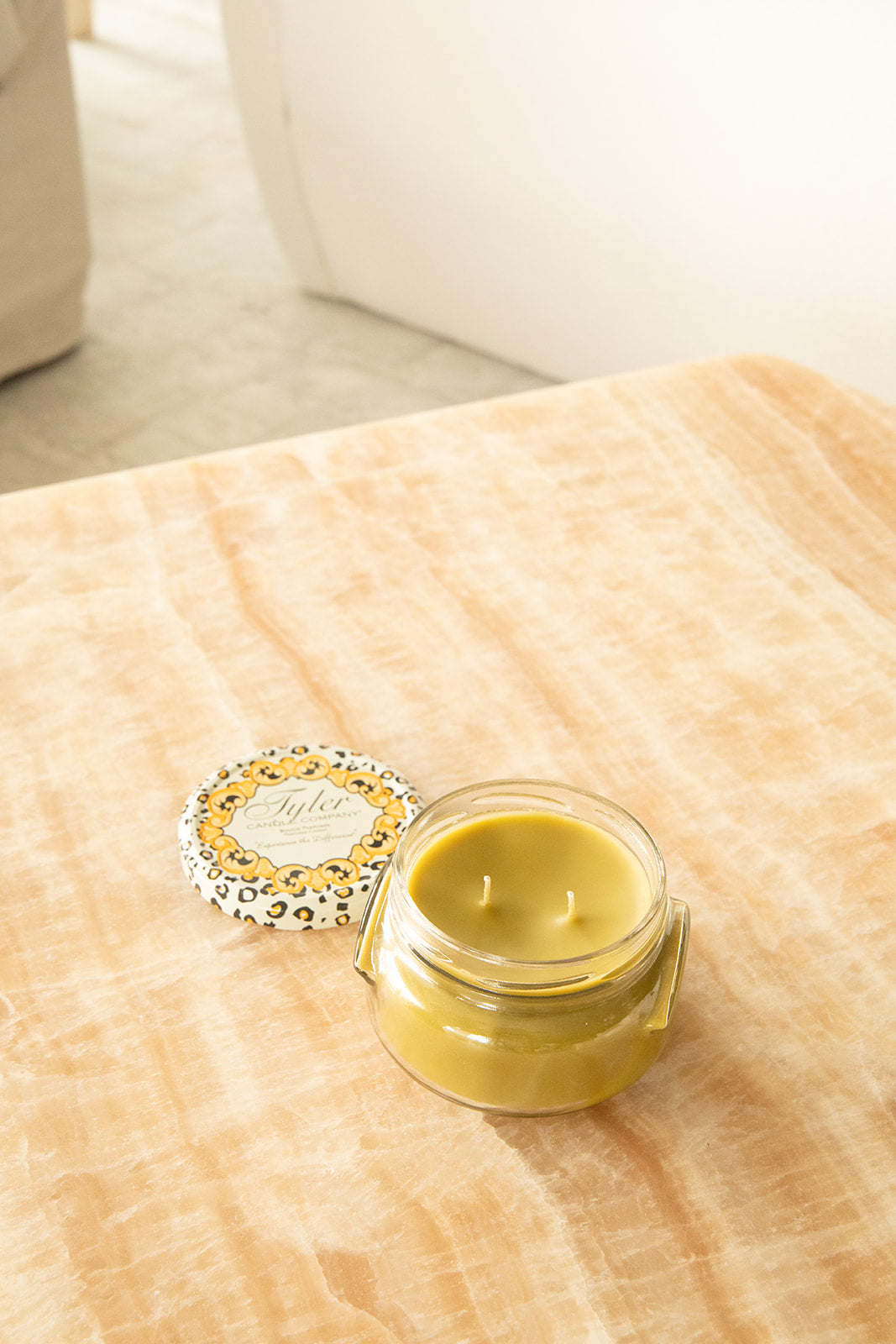 Product shot of Tyler Candle Company 11oz candle in scent tyler.