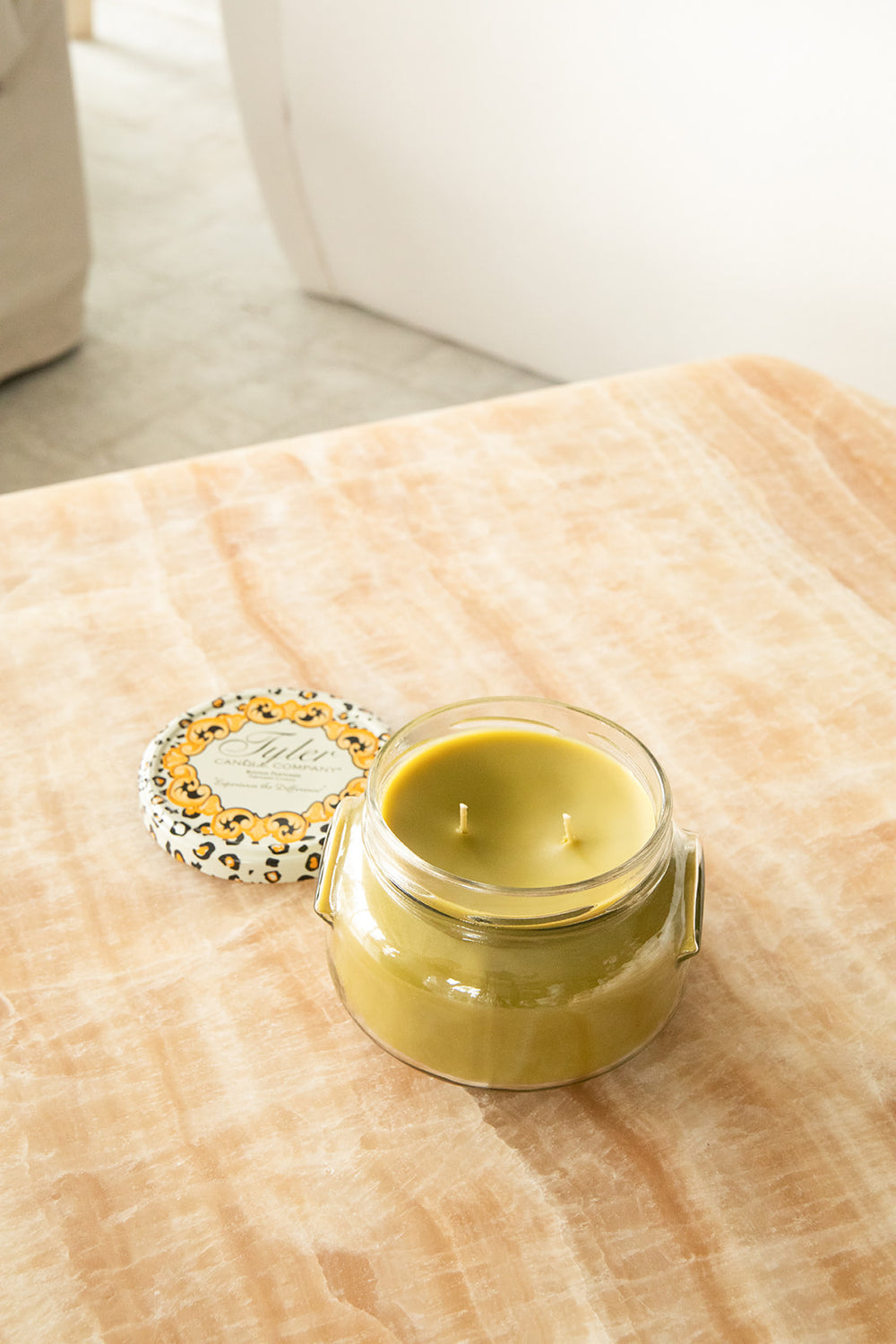 Product shot of Tyler Candle Company 22oz candle in scent tyler.