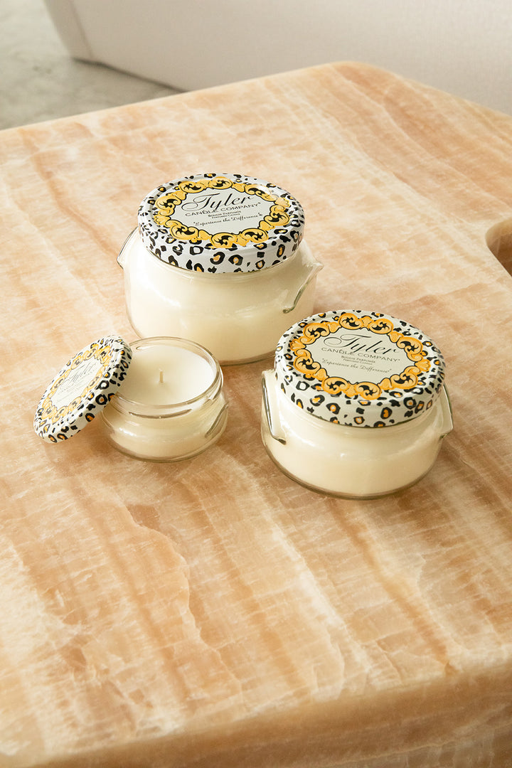 Product shot of Tyler Candle Company candles in 22oz, 11oz, and 3.4oz in scent winter wonderland.