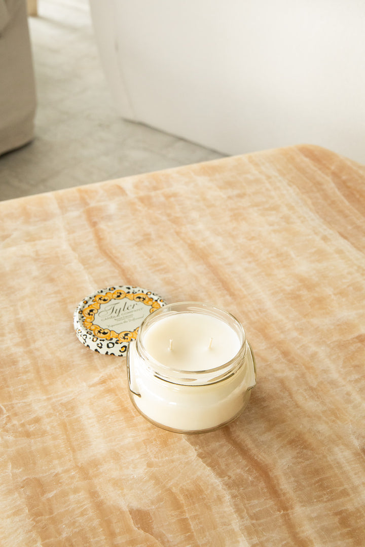 Product shot of Tyler Candle Company 11oz candle in scent glamfam.