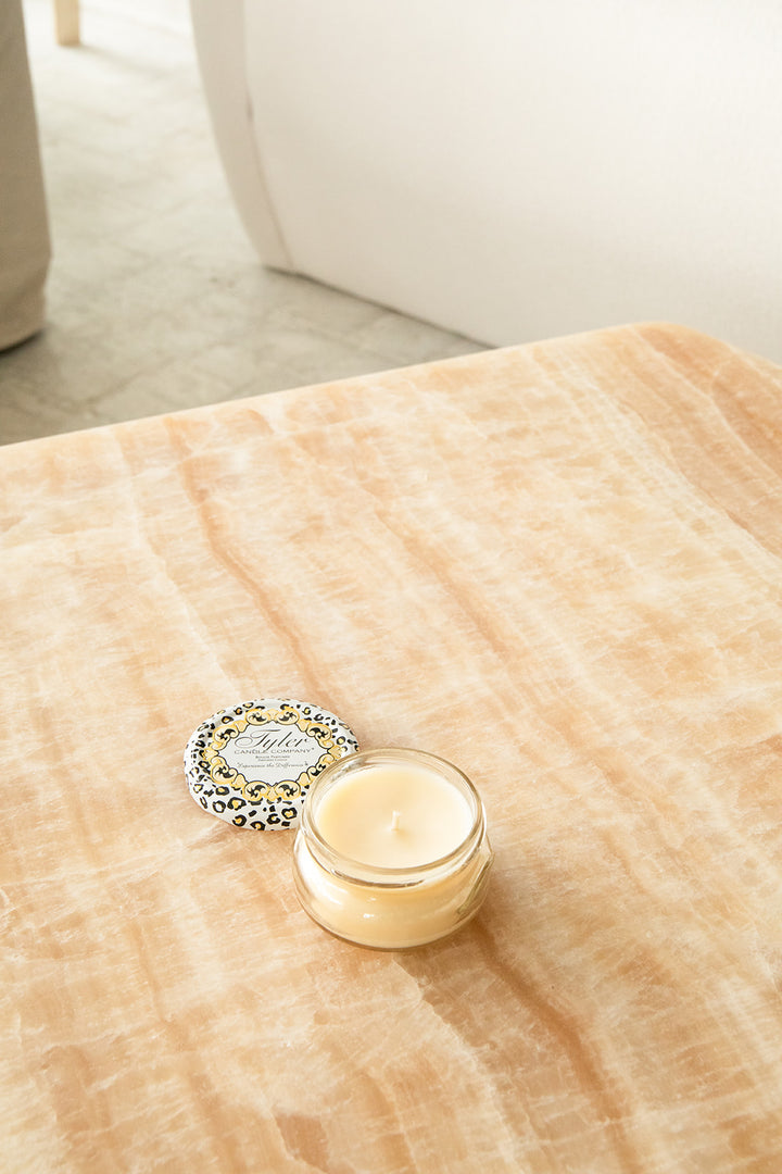 Product shot of Tyler Candle Company 3.4oz candle in scent homecoming.