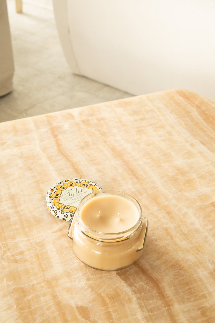 Product shot of Tyler Candle Company 11oz candle in scent icon.