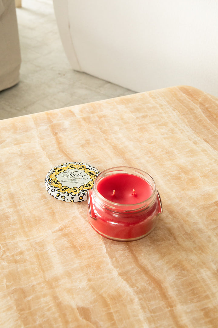 Product shot of Tyler Candle Company 11oz candle in scent kathina.