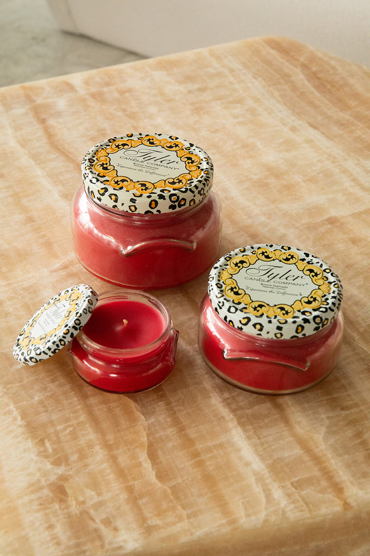 Product shot of Tyler Candle Company candles in 22oz, 11oz, and 3.4oz in scent kathina.
