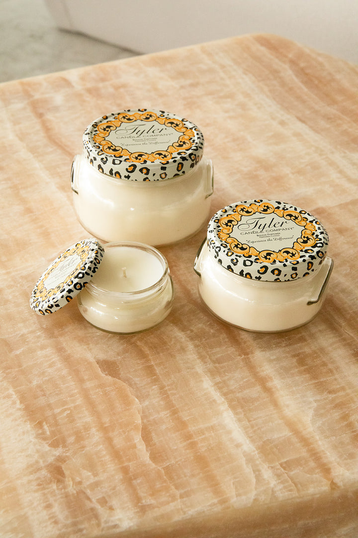 Product shot of Tyler Candle Company candles in 22oz, 11oz, and 3.4oz in scent wishlist.